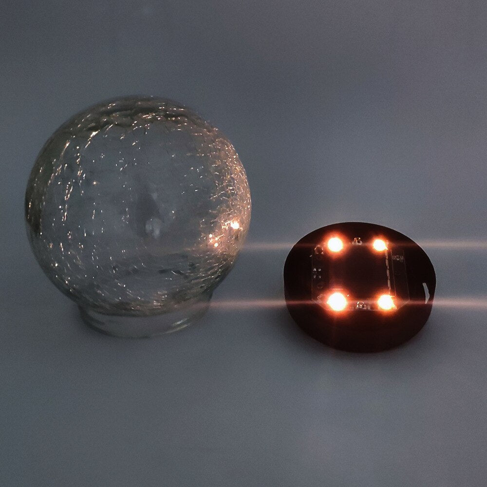 GlowGlobe - Solar-gestrickte Glasleuchte mit Erdspieß
